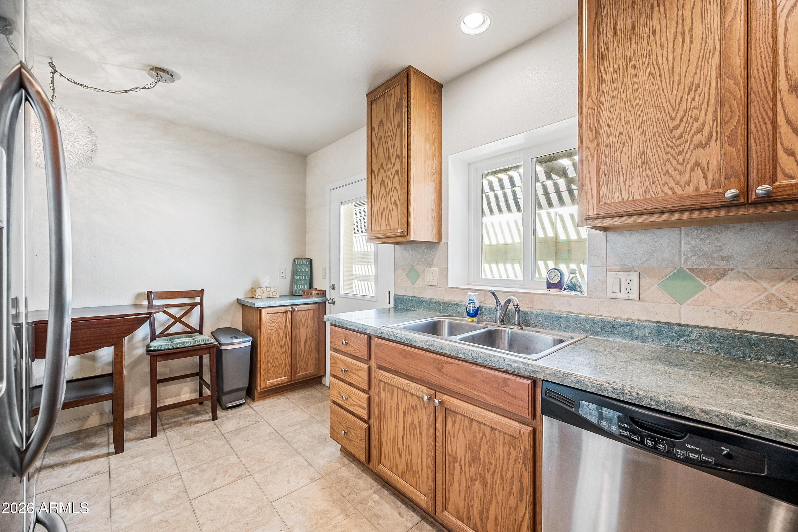 1108 West Mission Lane Phoenix, AZ 85021 - Photo 9 of 30 a kitchen that has a sink and a stove in it