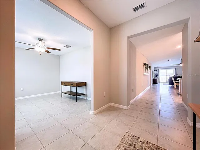 a large kitchen with stainless steel appliances granite countertop a sink stove and microwave