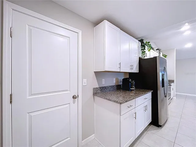 a living room with furniture and a ceiling fan