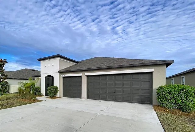 front view of a house with a yard