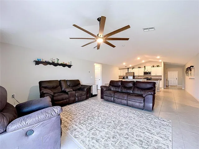 a spacious bathroom with a granite countertop sink and a mirror