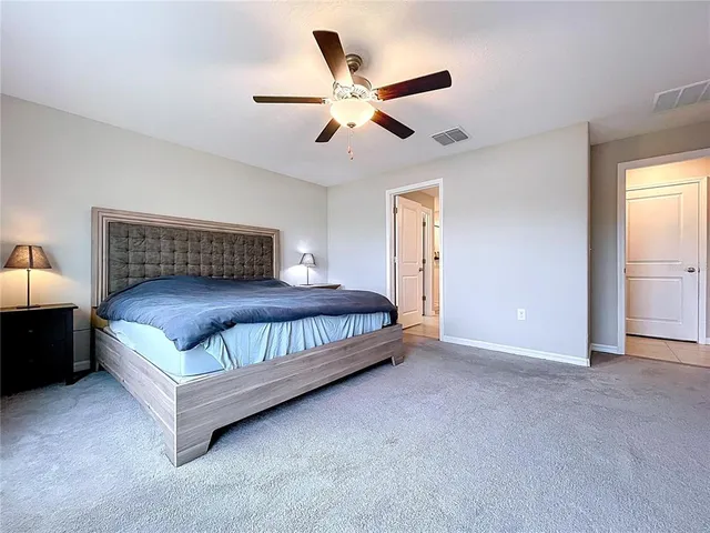 a view of walk in closet with clothes