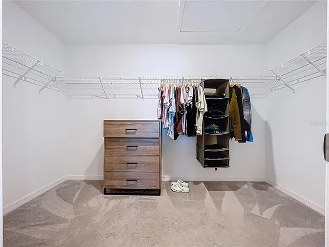 an aerial view of multiple houses with a yard