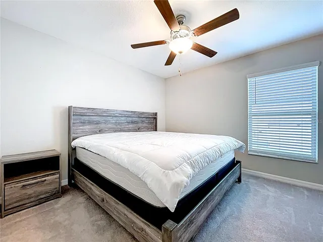 an aerial view of residential houses with outdoor space and river