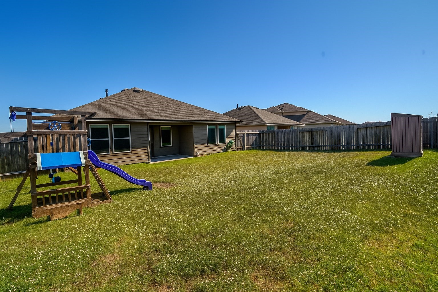 1714 Cooper Bluff Court Rosenberg, TX 77469 - Photo 18 of 21 a view of a house with swimming pool and a yard
