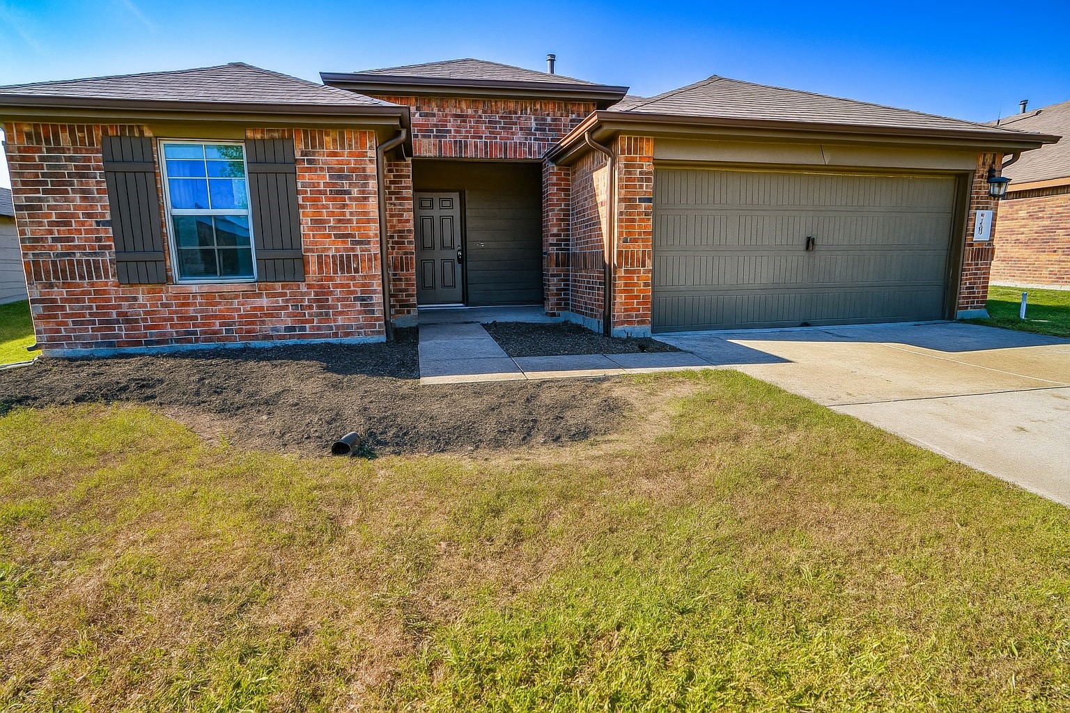 1714 Cooper Bluff Court Rosenberg, TX 77469 - Photo 20 of 21 a front view of a house with garden