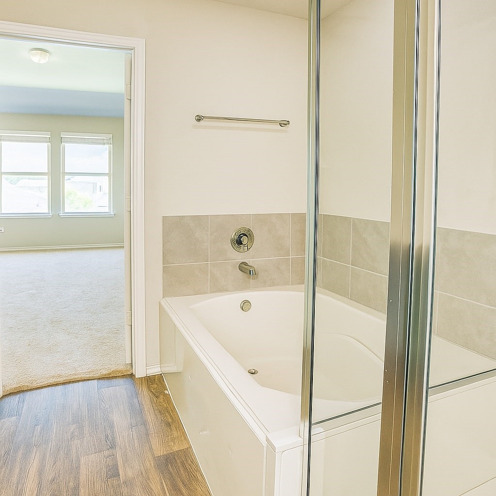 1714 Cooper Bluff Court Rosenberg, TX 77469 - Photo 7 of 21 a bathroom with a tub and shower