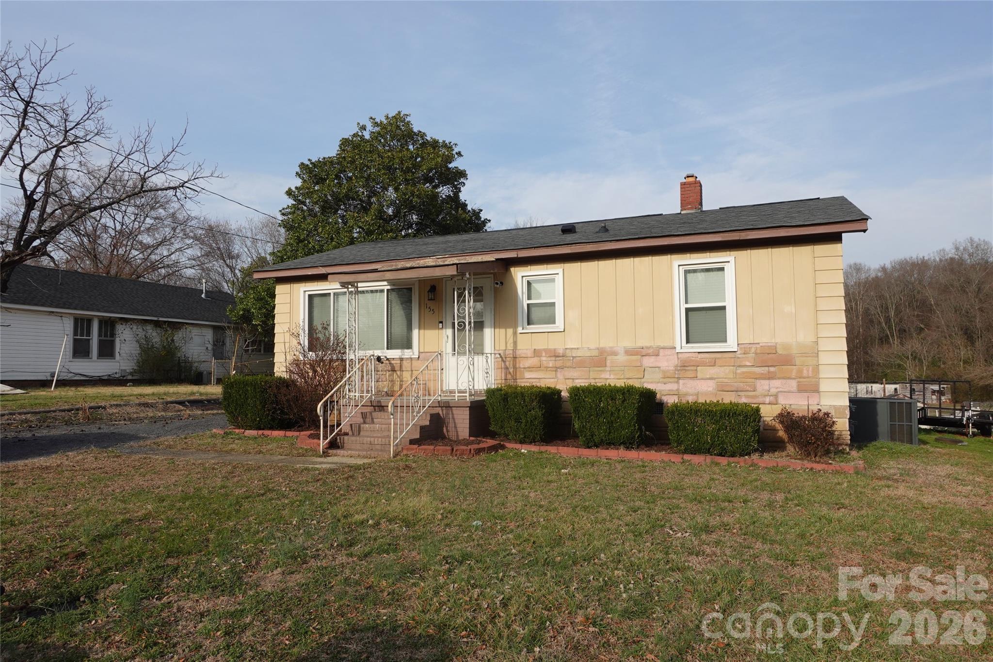 155 Robbins Street Southwest Concord, NC 28025 - Photo 1 of 19 a front view of a house with a yard