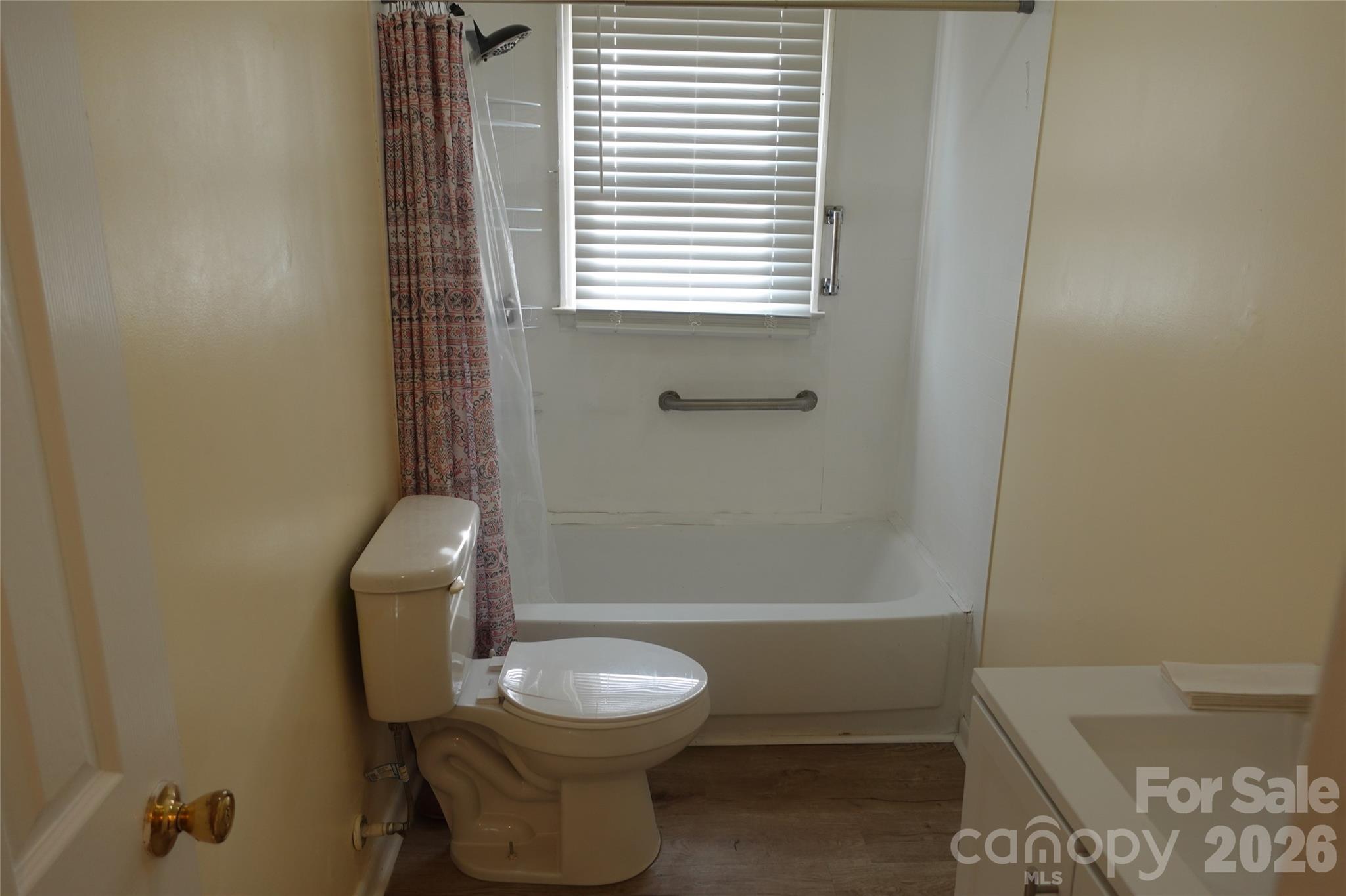155 Robbins Street Southwest Concord, NC 28025 - Photo 12 of 19 a bathroom with a toilet a sink and bathtub