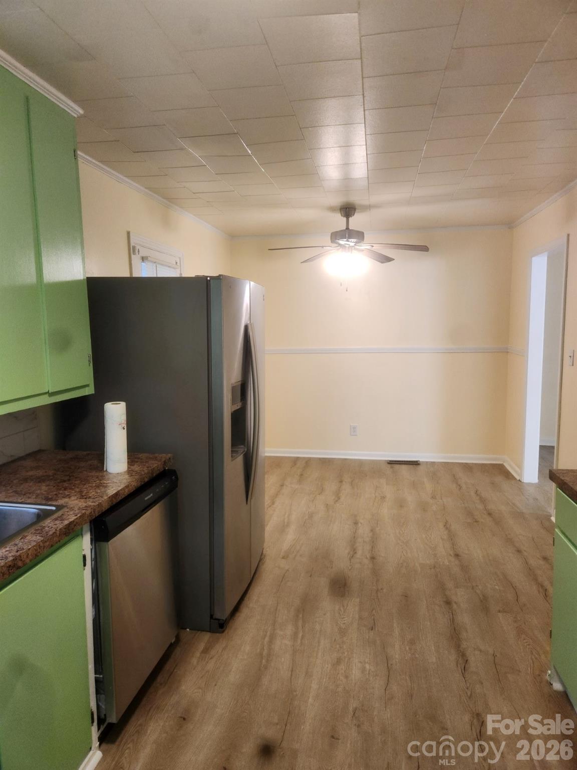155 Robbins Street Southwest Concord, NC 28025 - Photo 17 of 19 a kitchen with stainless steel appliances a refrigerator and a counter top space