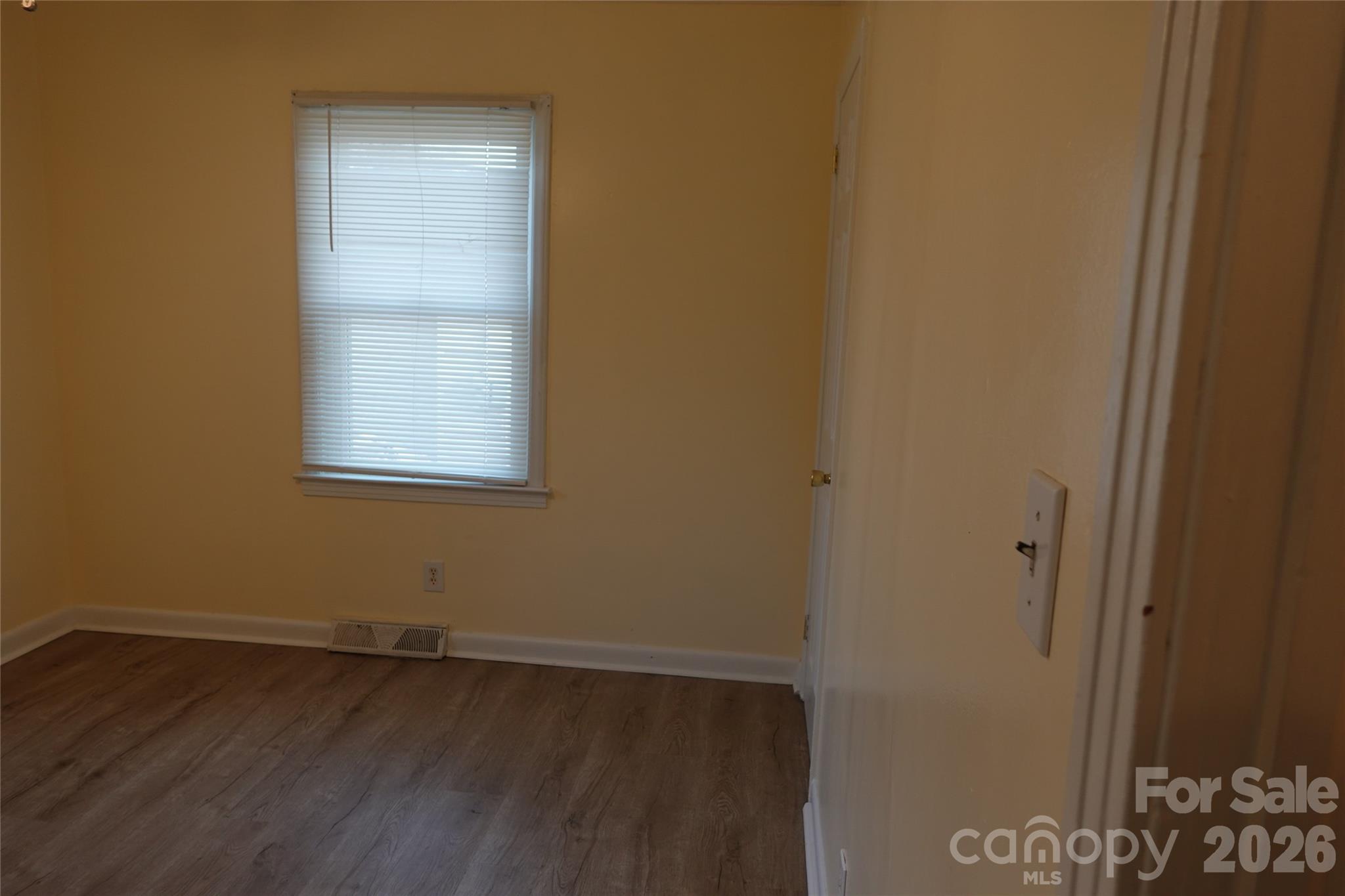 155 Robbins Street Southwest Concord, NC 28025 - Photo 10 of 19 an empty room with a door