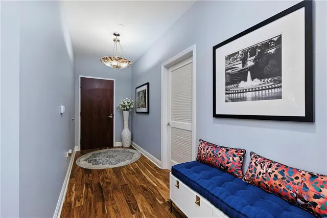 wooden floor in a hall with a dining table and chairs