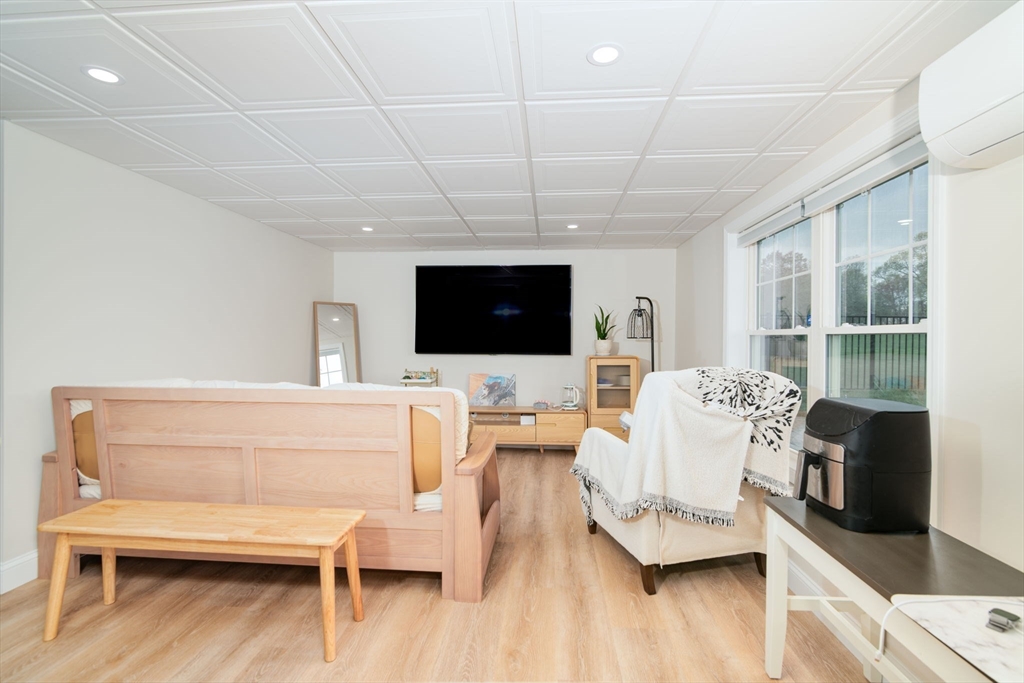 51 Tamarack Road Dracut, MA 01826 - Photo 24 of 39 a living room with furniture and a flat screen tv
