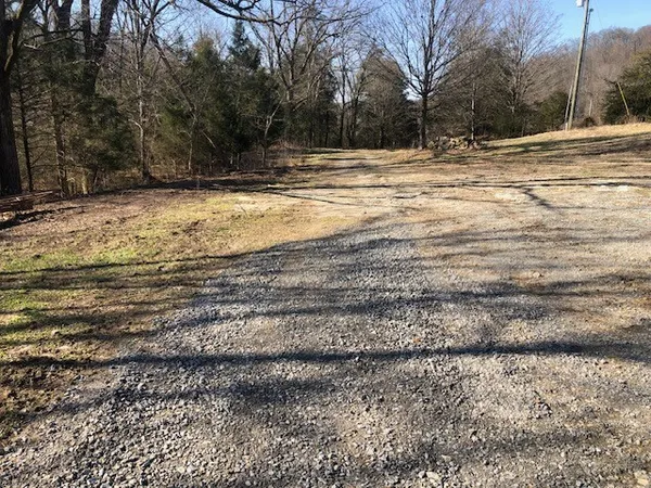 a view of a yard with a house