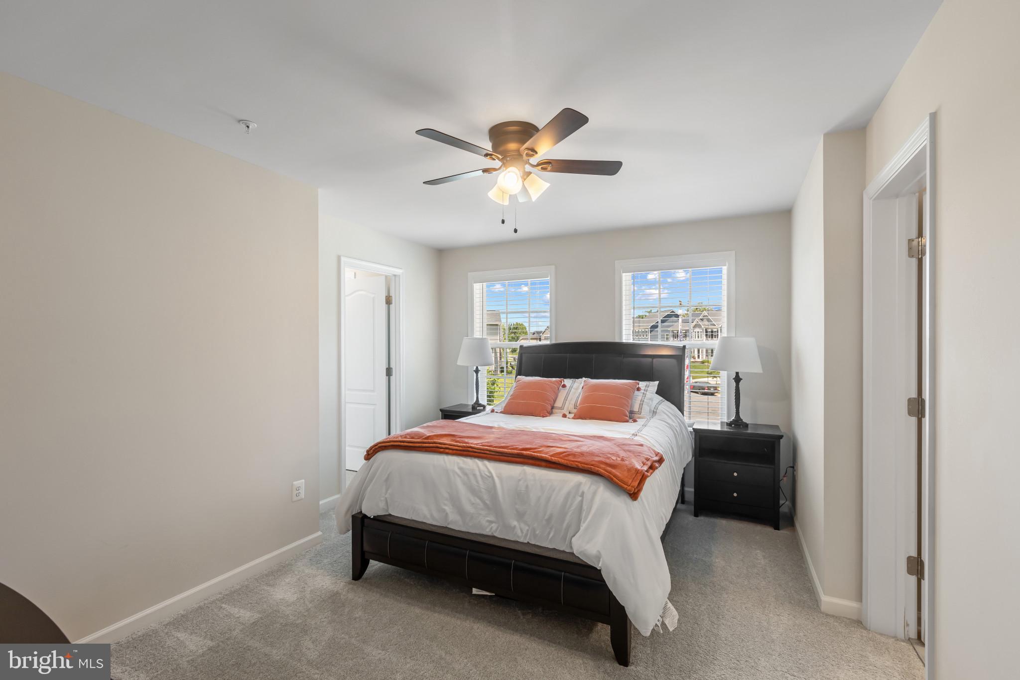 9909 Kildore Way Fort Washington, MD 20744 - Photo 17 of 43 a bedroom with a bed and a chandelier