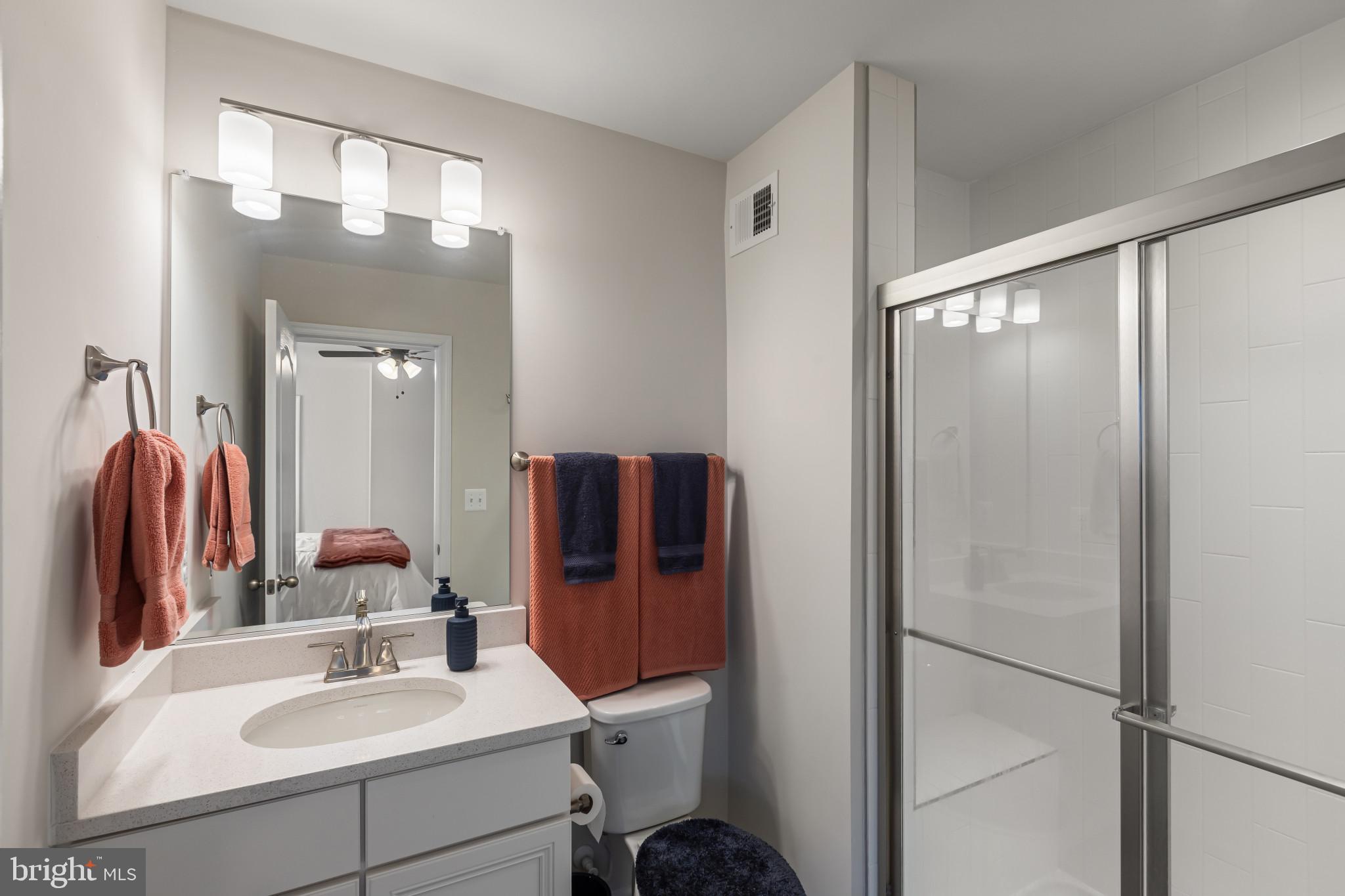 9909 Kildore Way Fort Washington, MD 20744 - Photo 18 of 43 a bathroom with a sink vanity and mirror