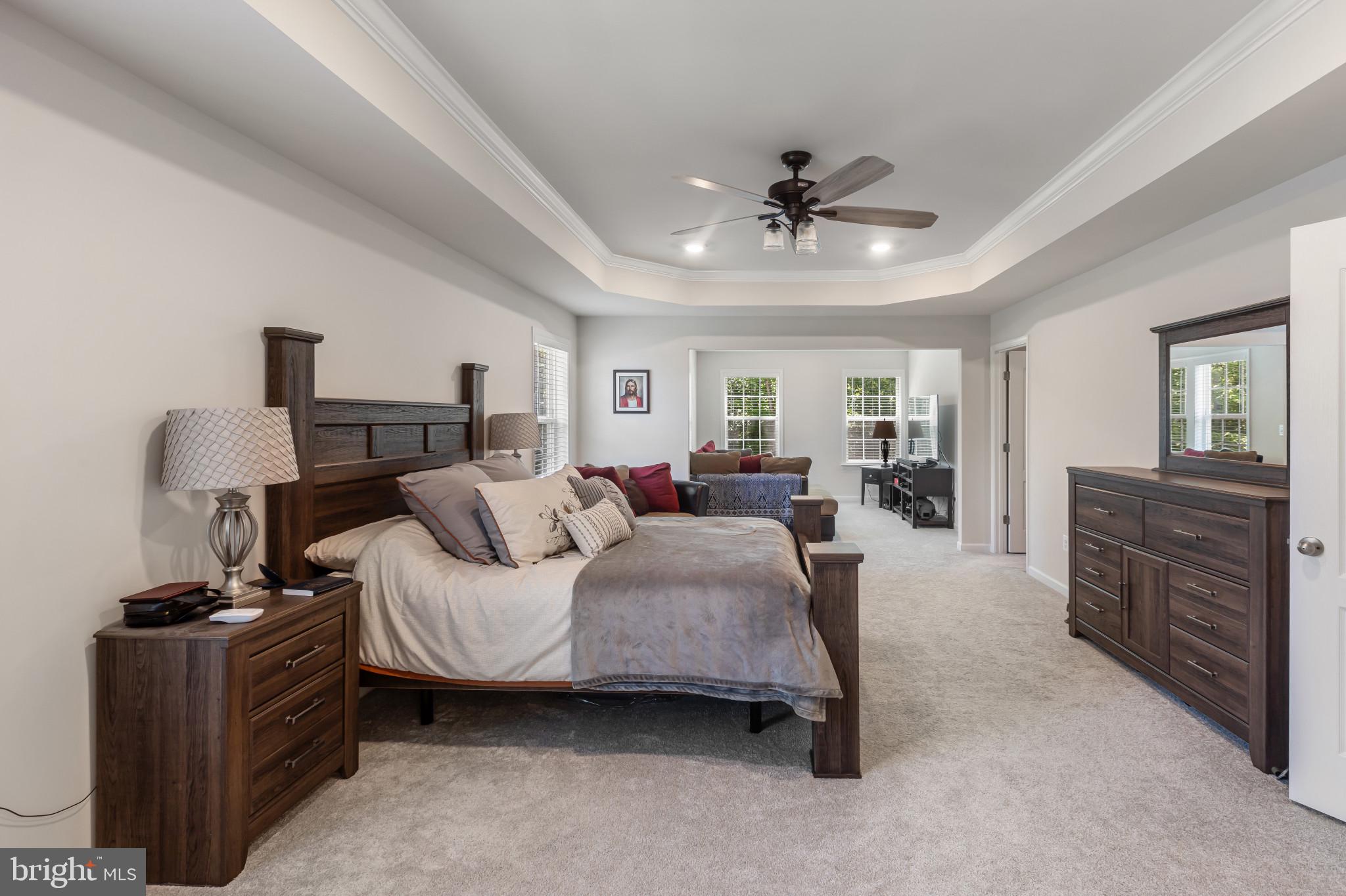 9909 Kildore Way Fort Washington, MD 20744 - Photo 24 of 43 a living room with furniture a ceiling fan and a dresser