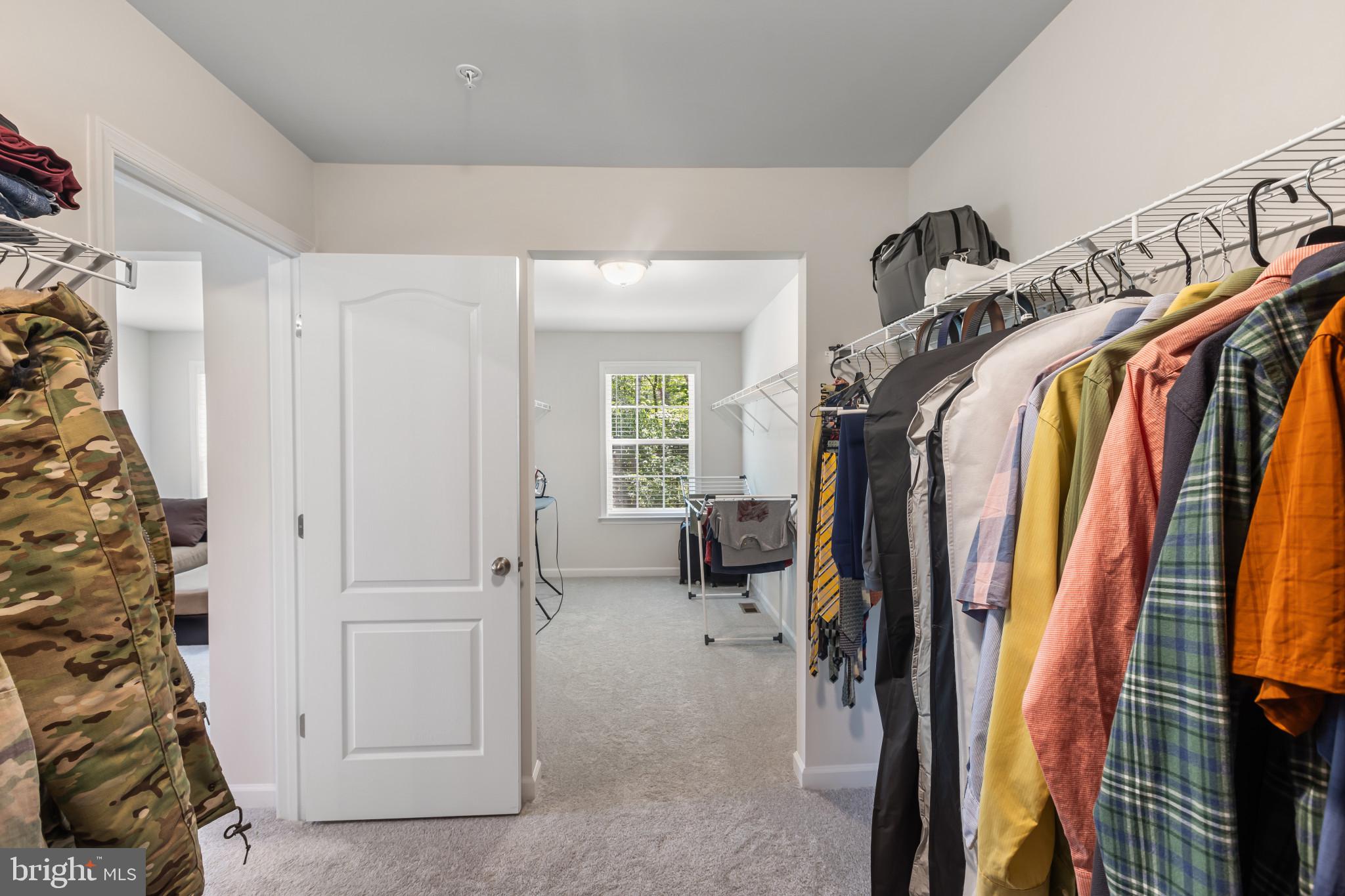9909 Kildore Way Fort Washington, MD 20744 - Photo 27 of 43 a view of walk in closet with clothes and shoes
