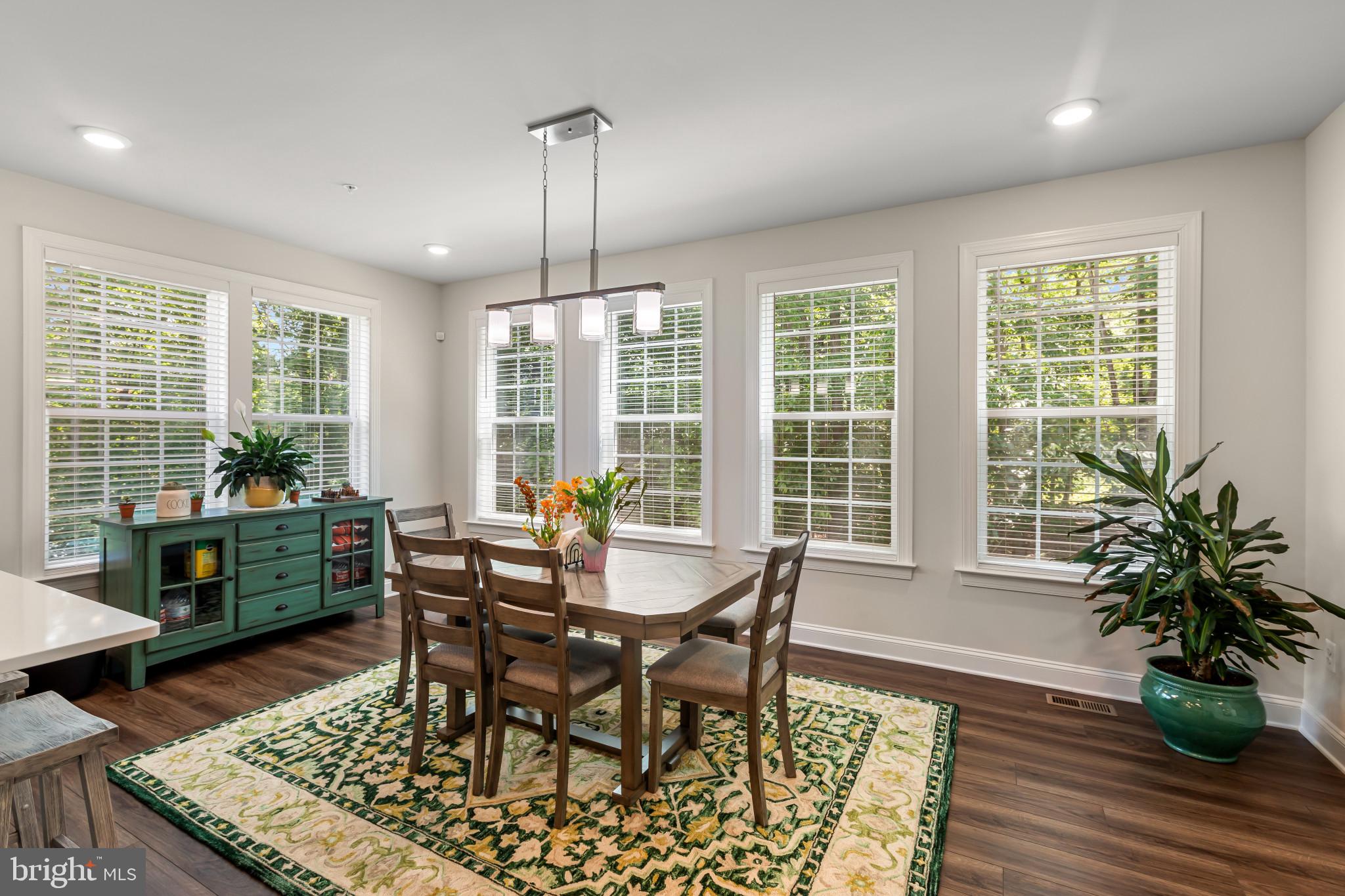 9909 Kildore Way Fort Washington, MD 20744 - Photo 33 of 43 a view of a dining room with furniture window and wooden floor
