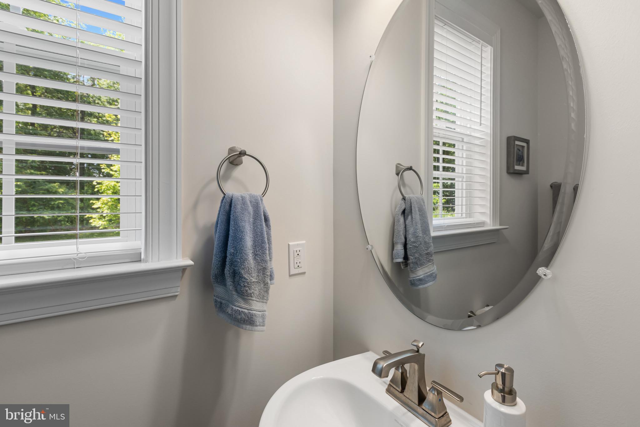 9909 Kildore Way Fort Washington, MD 20744 - Photo 8 of 43 a bathroom with a sink mirror and window