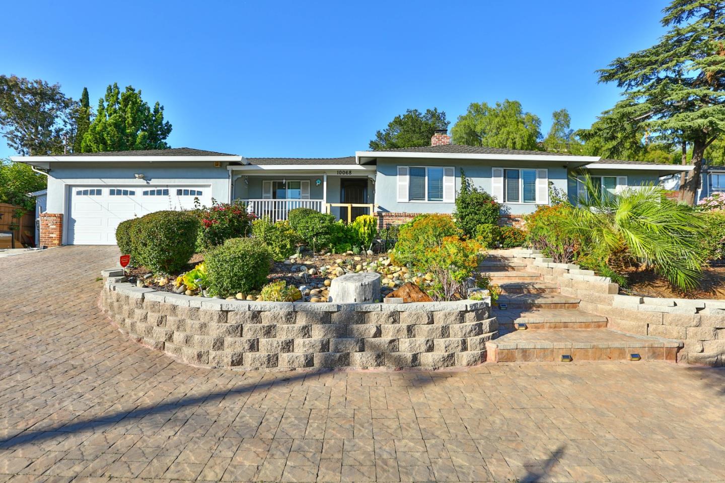 10068 Clayton Road San Jose, CA 95127 - Photo 1 of 34 a front view of a house with a yard