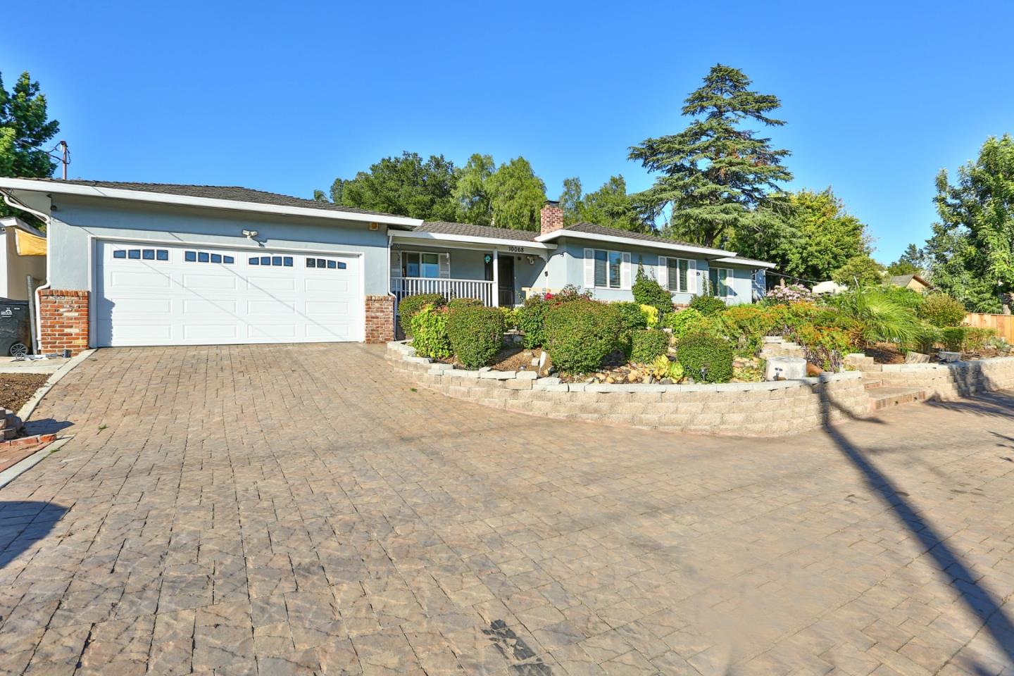 10068 Clayton Road San Jose, CA 95127 - Photo 23 of 34 a front view of a house with a yard and a garage