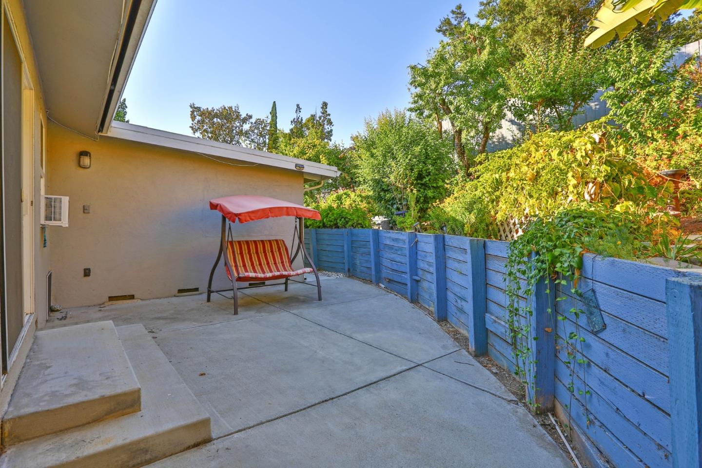 10068 Clayton Road San Jose, CA 95127 - Photo 25 of 34 a view of a backyard with wooden fence and plants