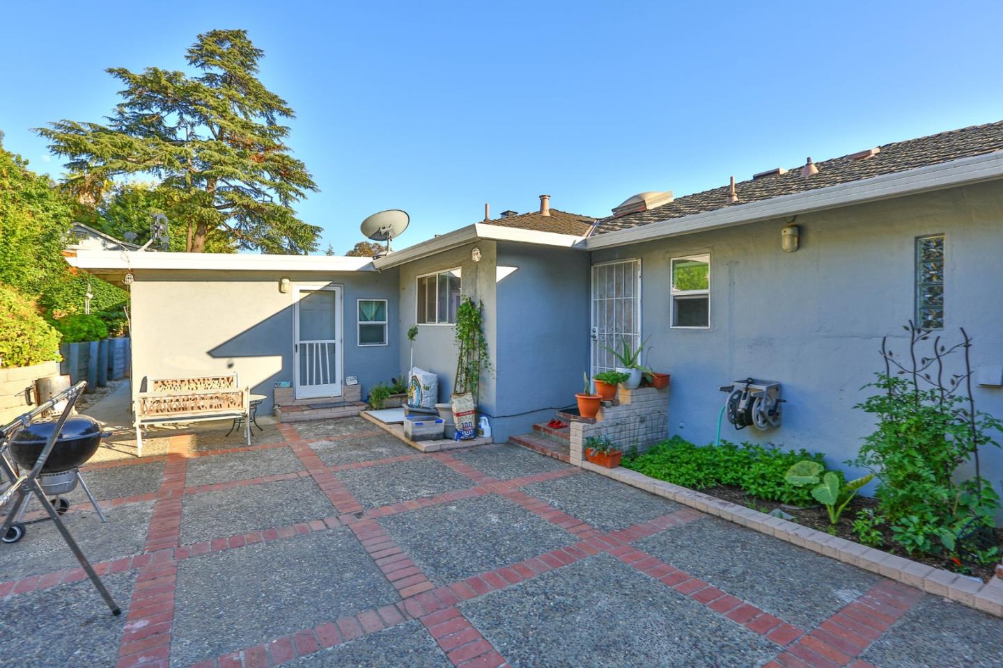 10068 Clayton Road San Jose, CA 95127 - Photo 28 of 34 a view of a patio with table and chairs and potted plants