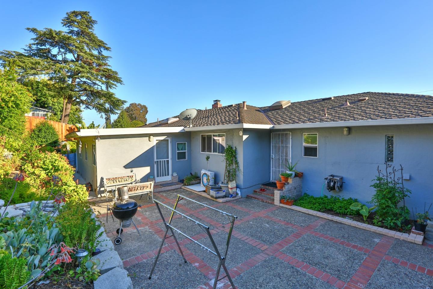 10068 Clayton Road San Jose, CA 95127 - Photo 29 of 34 a front view of a house with table and chairs