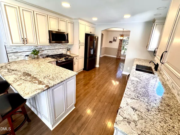an empty room with wooden floor and closet