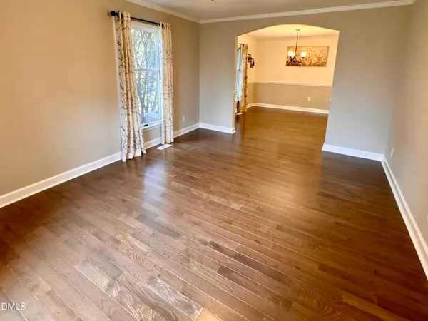 a view of livingroom with hardwood floor and a ceiling fan