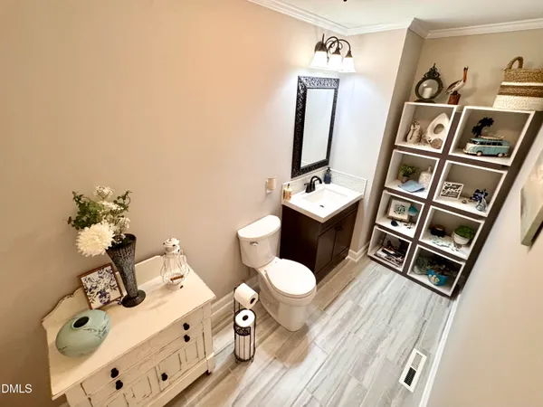 a bathroom with a sink a vanity and mirror
