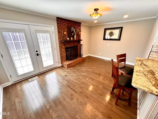 a dining room with furniture and a fireplace