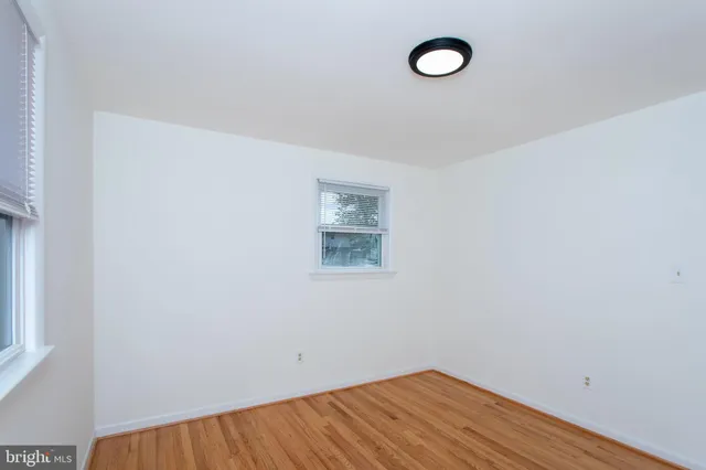 a view of a room with a fan and a window
