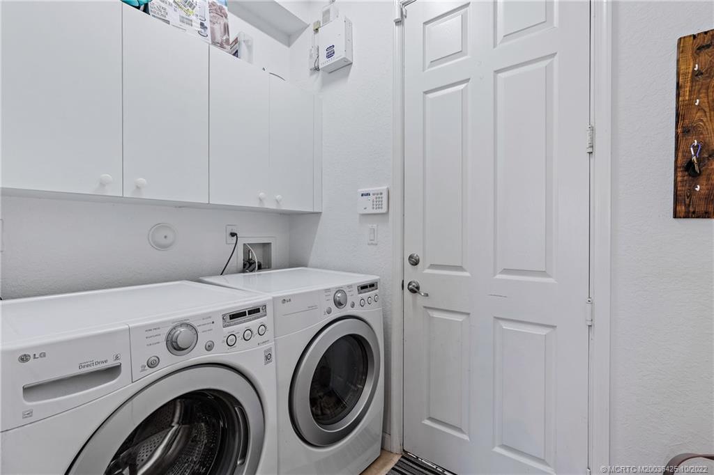 337 Southwest Otter Run Place Stuart, FL 34997 - Photo 7 of 15 a utility room with dryer and washer