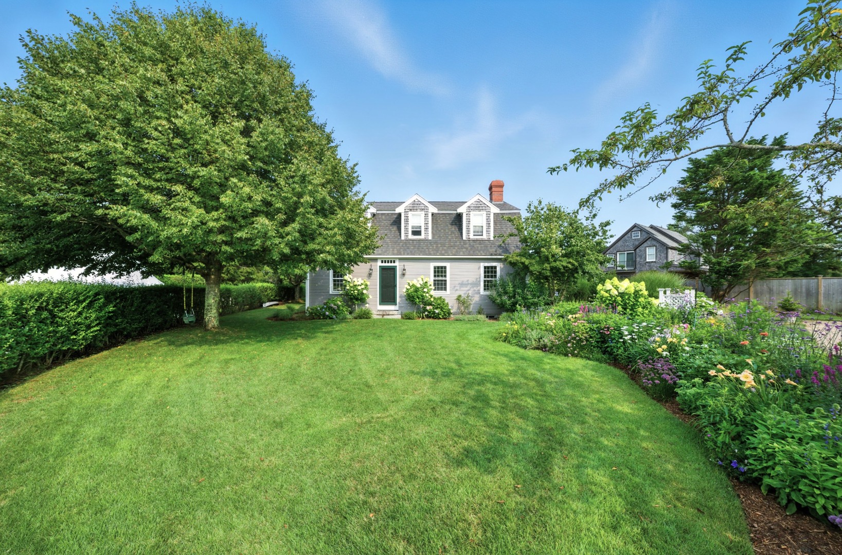 1 Halyard Lane Nantucket, MA 02554 - Photo 11 of 59 a front view of a house with a yard