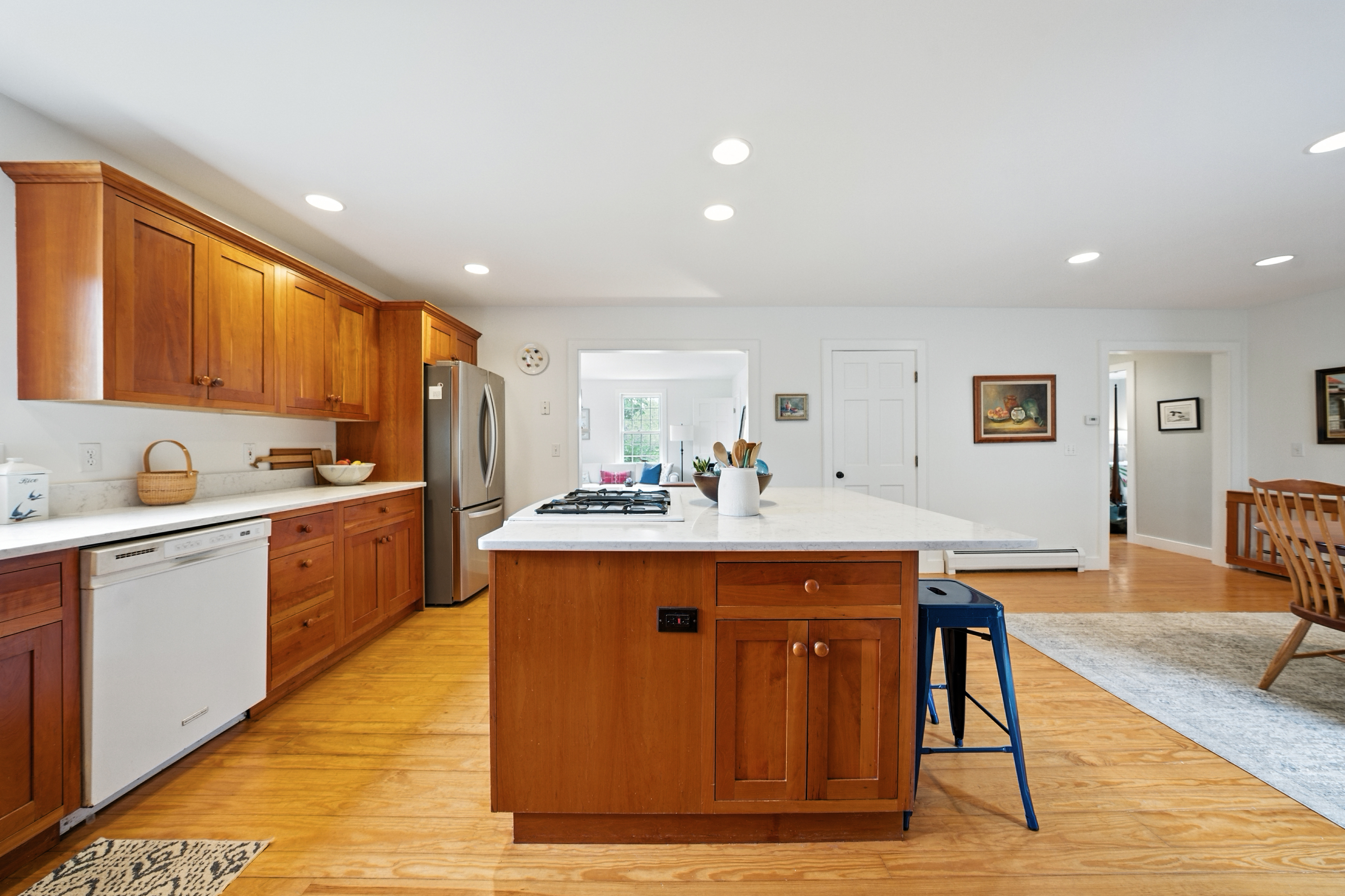 1 Halyard Lane Nantucket, MA 02554 - Photo 25 of 59 a kitchen with stainless steel appliances granite countertop a table chairs sink and cabinets