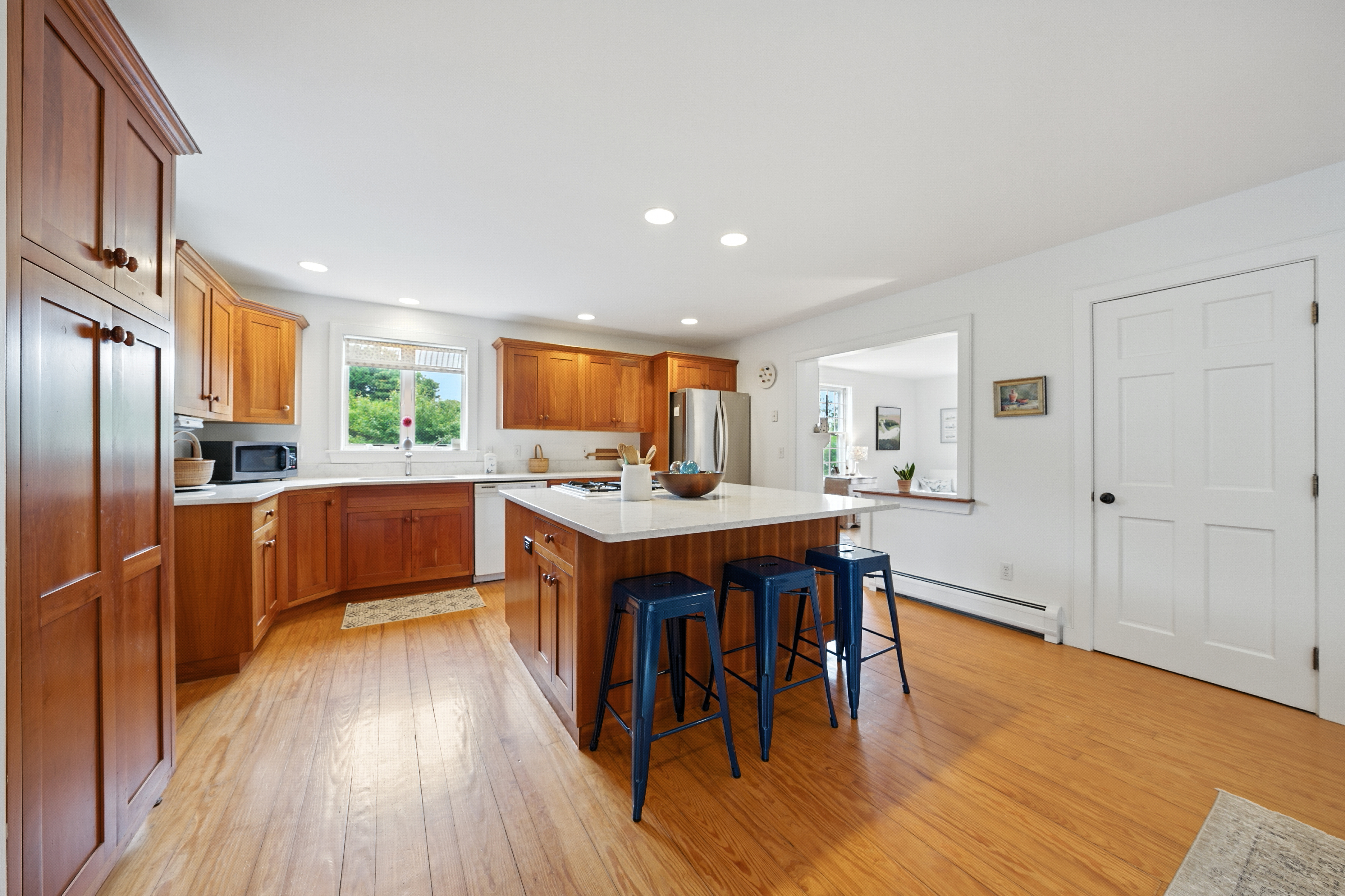 1 Halyard Lane Nantucket, MA 02554 - Photo 27 of 59 a kitchen with stainless steel appliances granite countertop a refrigerator a sink dishwasher and a stove with wooden floor