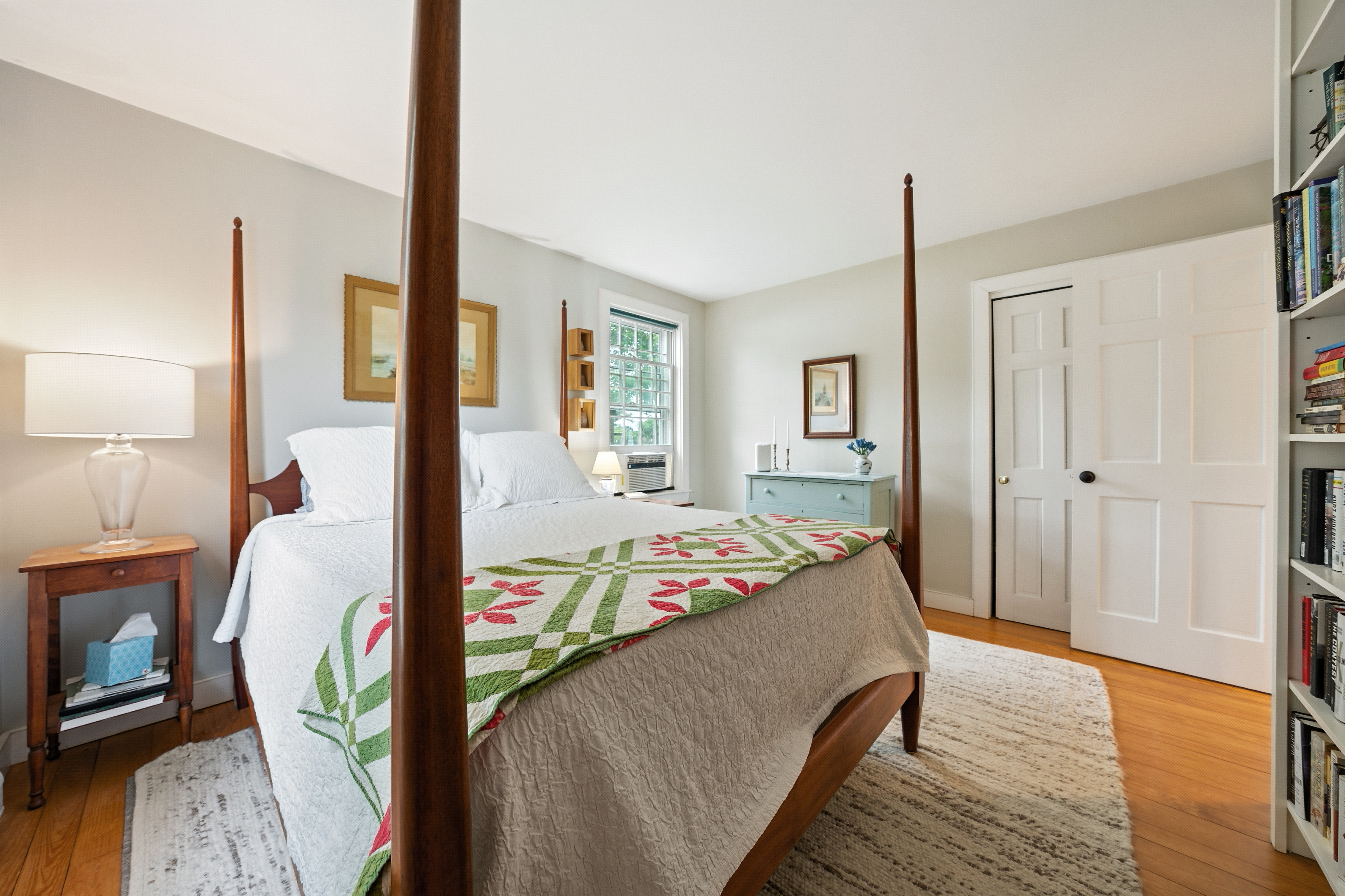 1 Halyard Lane Nantucket, MA 02554 - Photo 33 of 59 a bedroom with a bed a mirror on the dresser with wooden floor