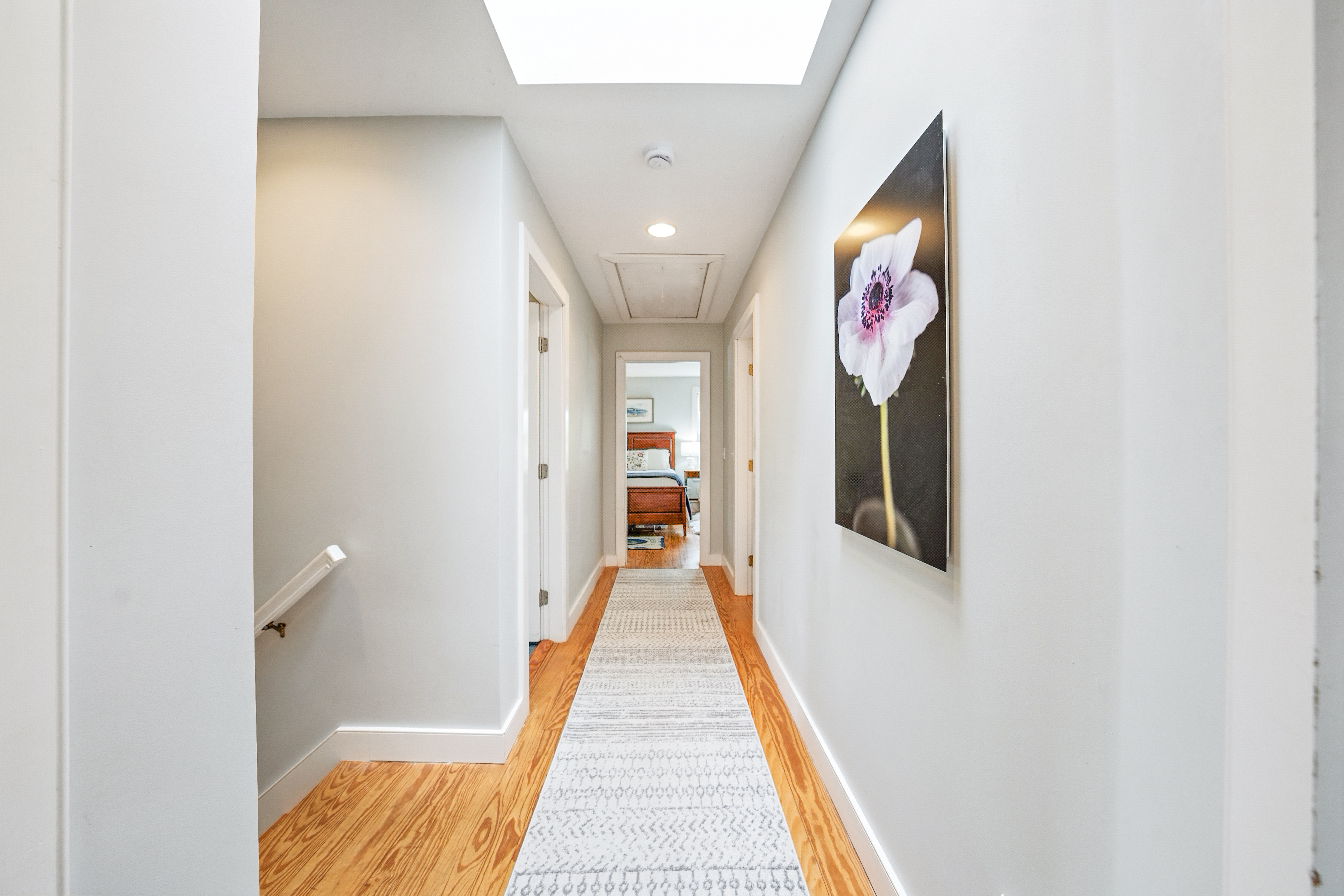 1 Halyard Lane Nantucket, MA 02554 - Photo 37 of 59 a view of a hallway with wooden floor and staircase