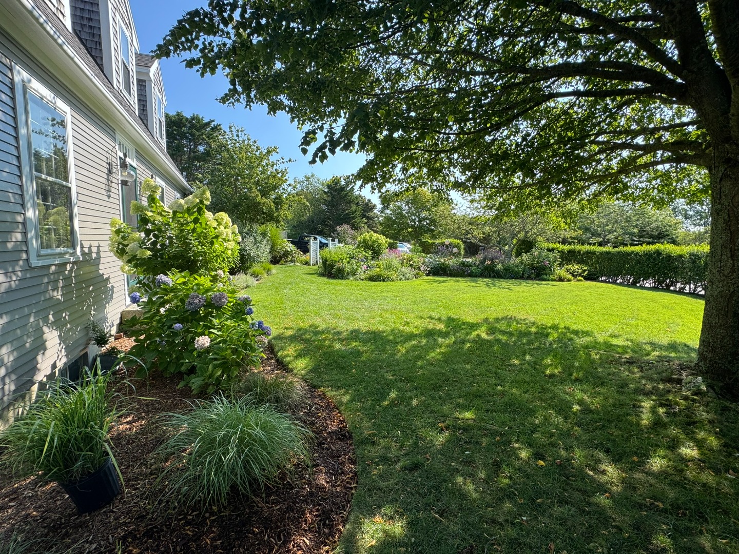 1 Halyard Lane Nantucket, MA 02554 - Photo 53 of 59 a view of a garden with a house