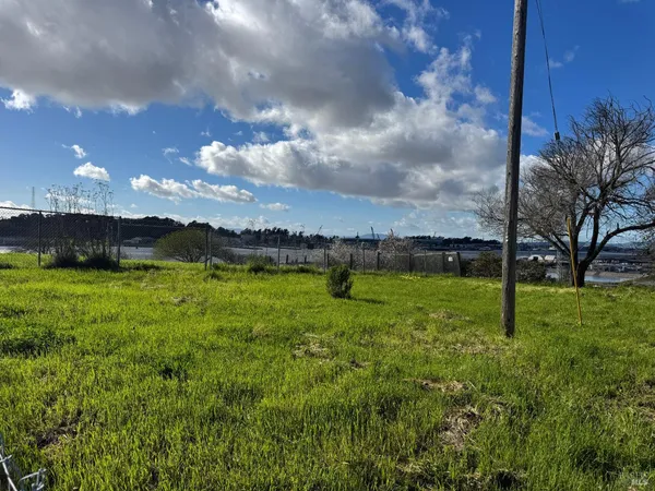 a view of a golf course with a lake