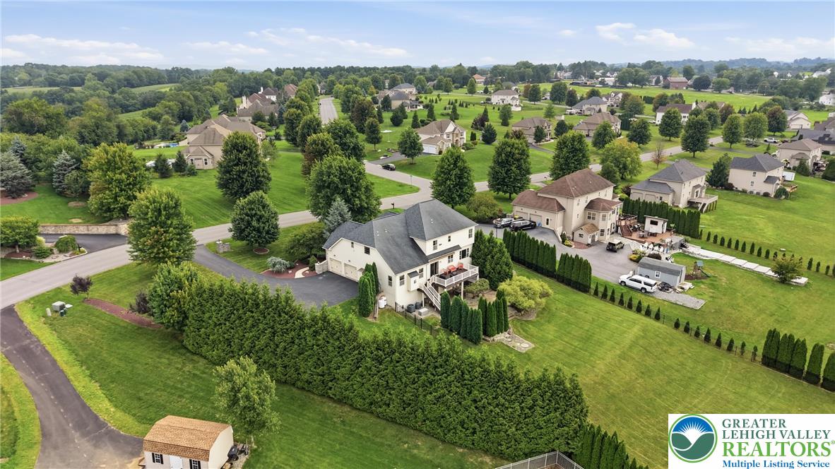 245 East Dell Road Bath, PA 18014 - Photo 92 of 99 An aerial perspective reveals a serene neighborhood with rolling green lawns and mature trees.