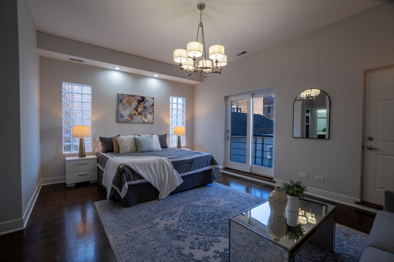 908 North Winchester Avenue Chicago, IL 60622 - Photo 17 of 46 a spacious bedroom with a bed and window