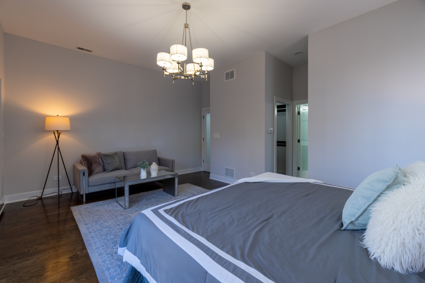 908 North Winchester Avenue Chicago, IL 60622 - Photo 19 of 46 a bed room with a bed and a chandelier