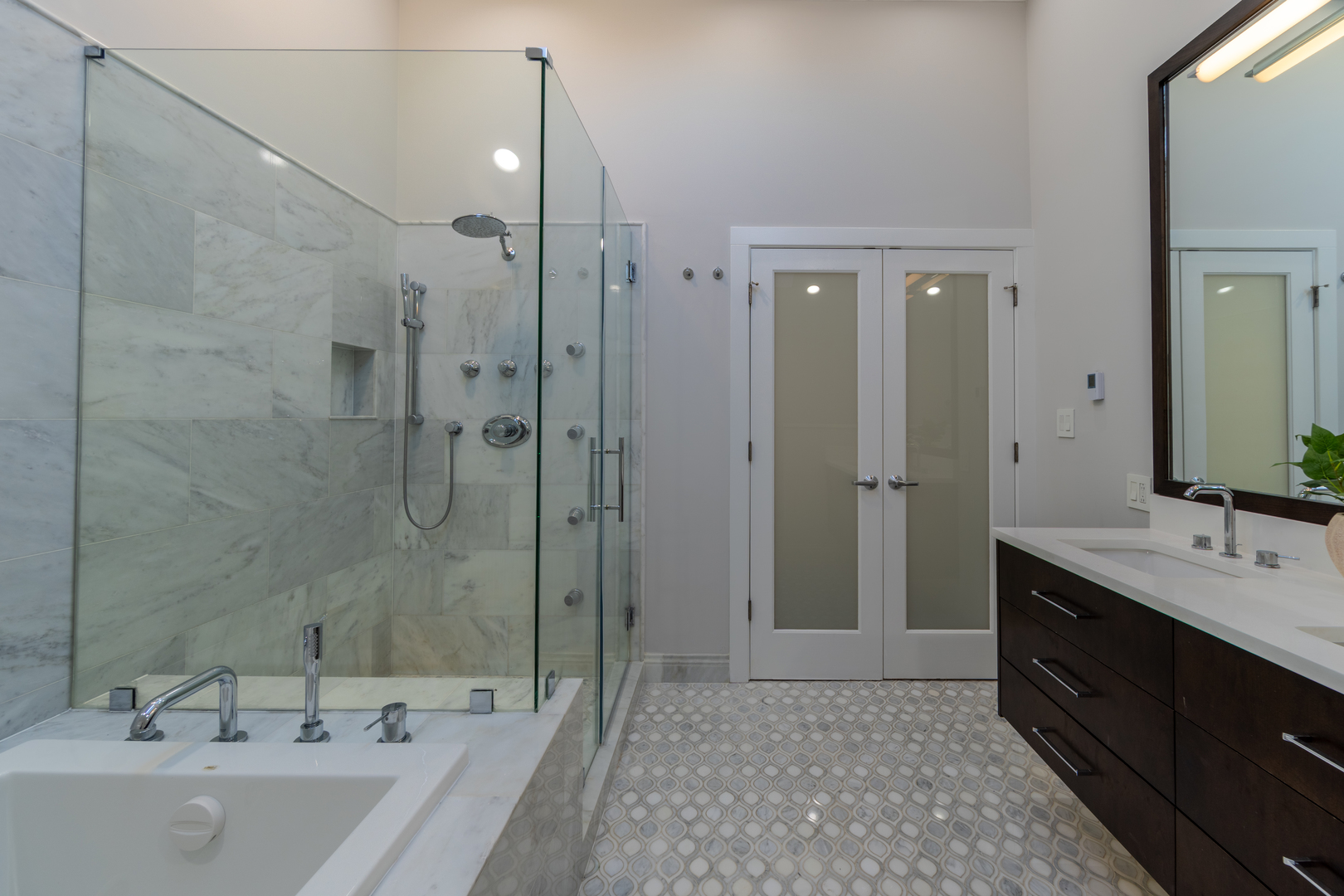 908 North Winchester Avenue Chicago, IL 60622 - Photo 26 of 46 a bathroom with a tub sink shower and two mirror
