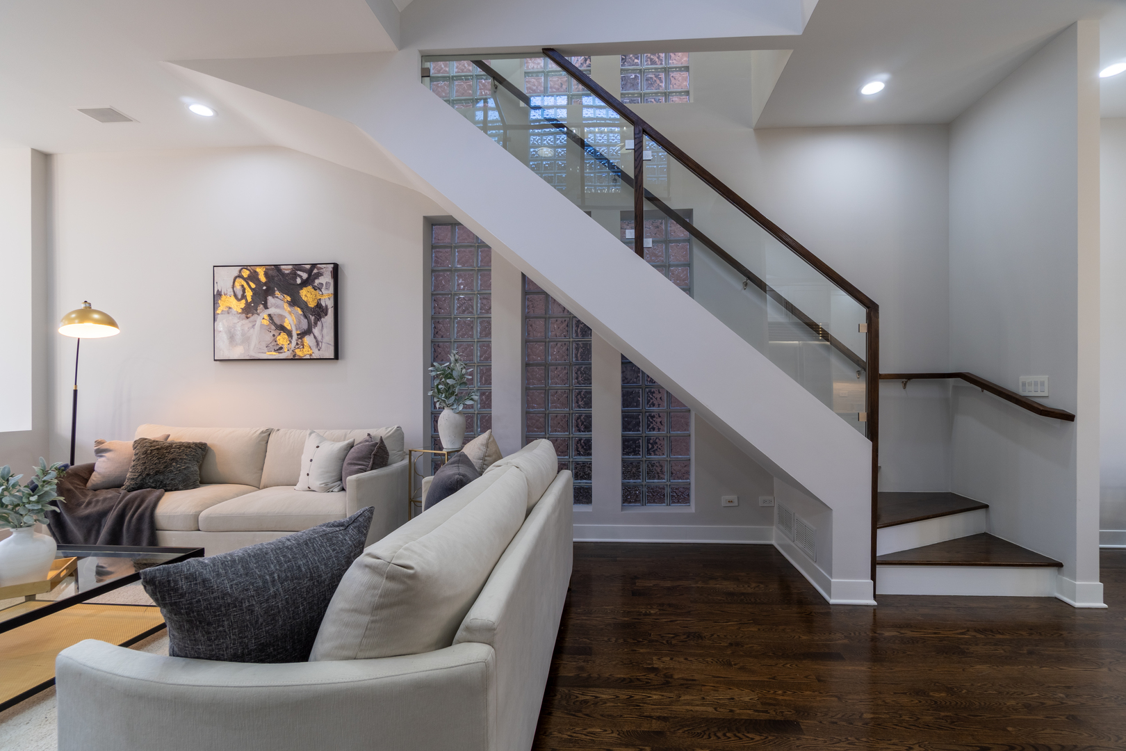 908 North Winchester Avenue Chicago, IL 60622 - Photo 5 of 46 a living room with furniture and stairs