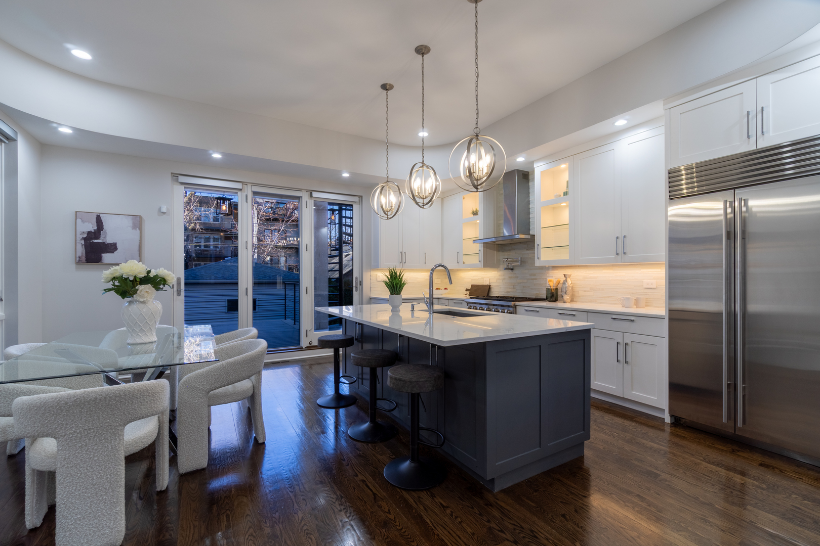 908 North Winchester Avenue Chicago, IL 60622 - Photo 7 of 46 a large kitchen with a table and chairs