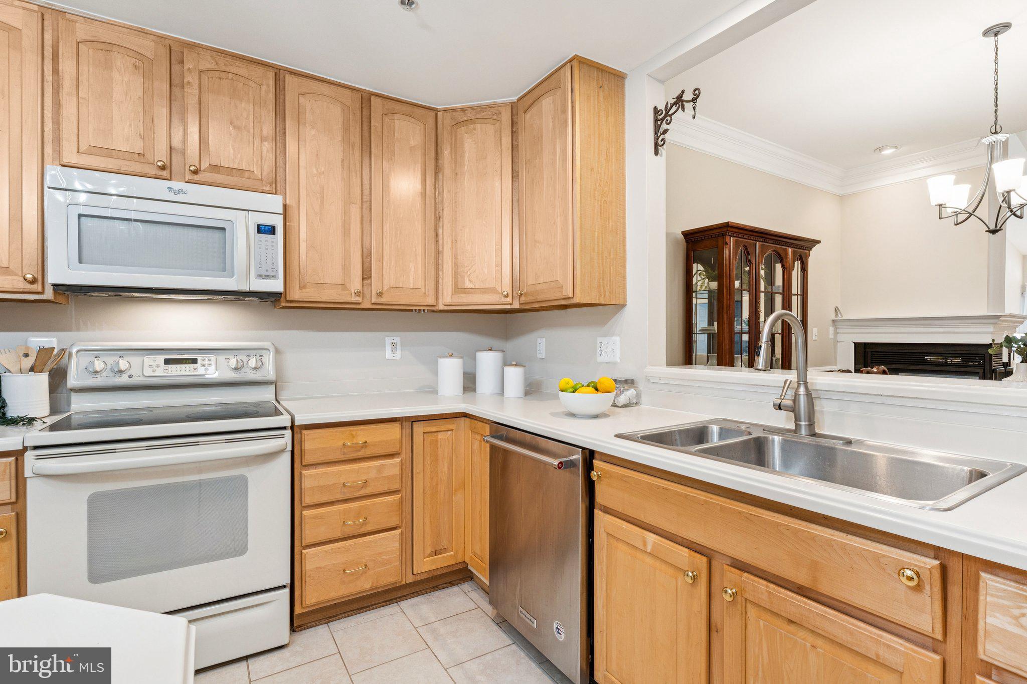 381 Colony Point Place Edgewater, MD 21037 - Photo 14 of 37 a kitchen with granite countertop a sink stainless steel appliances and cabinets