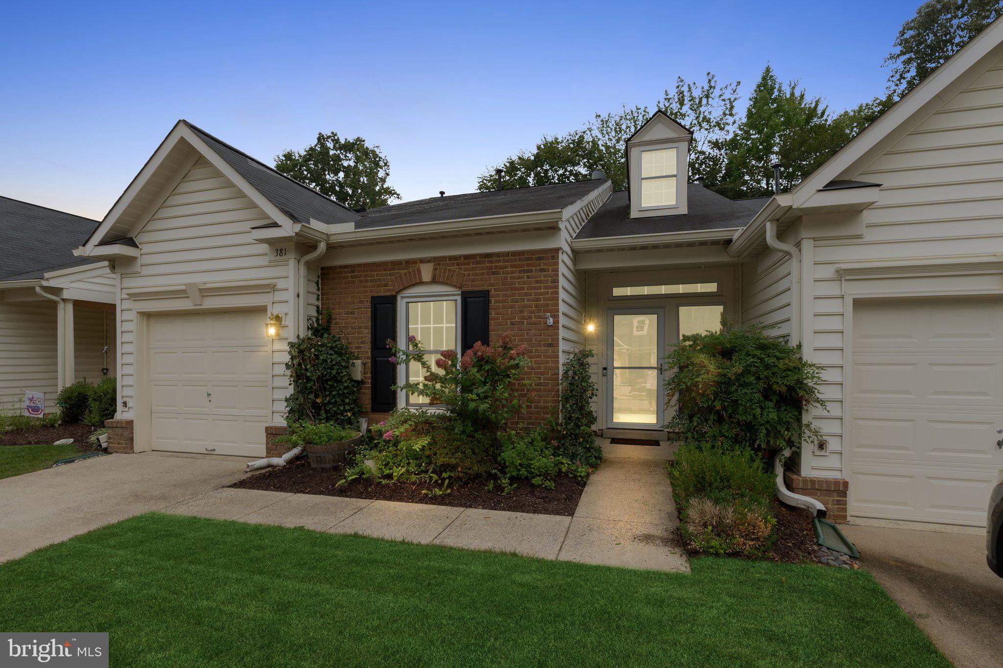 381 Colony Point Place Edgewater, MD 21037 - Photo 2 of 37 front view of a house with a yard